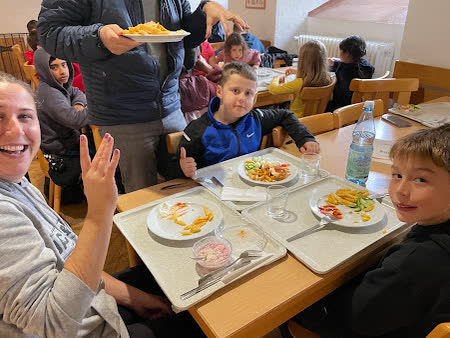 Kids at the lunch table in the youth hostel