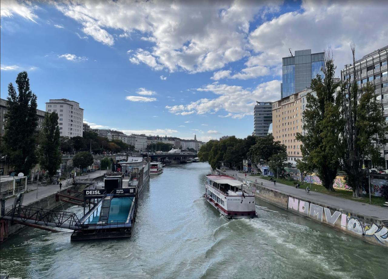 The Danube Canal in Vienna - Blue Danube boat and a sauna pop-up on the water