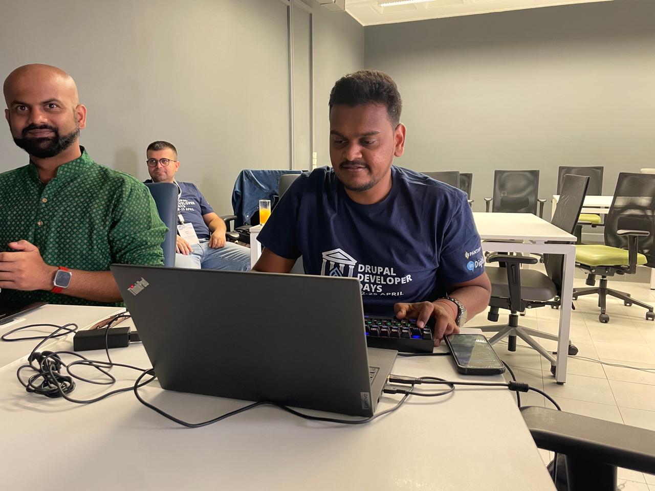 Anand and Dipak working side by side on their respective projects during the 90-minute coding session