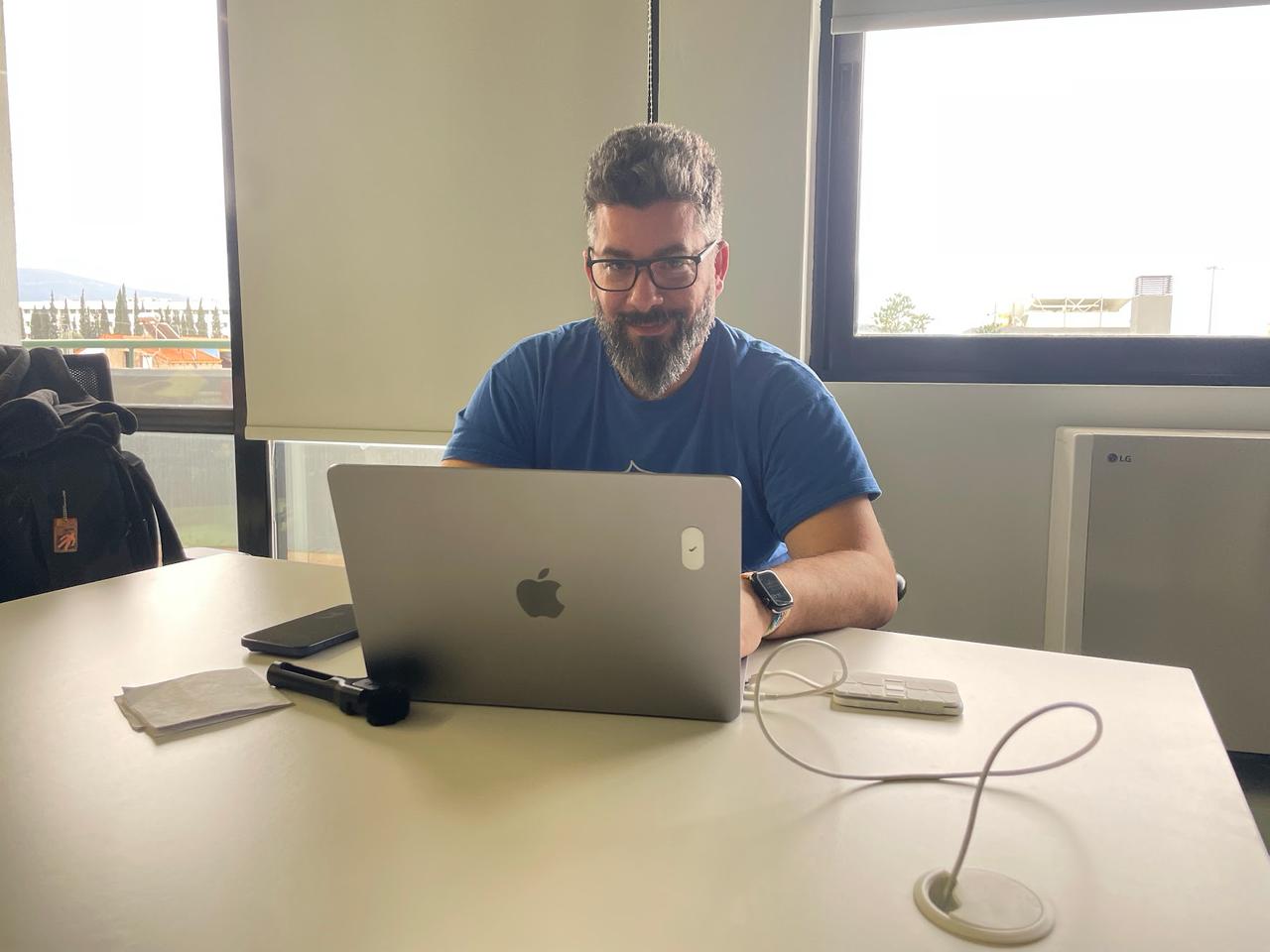 Nico Grienauer at his laptop building the Drupal Icebreaker app during the Vibe Coding Challenge