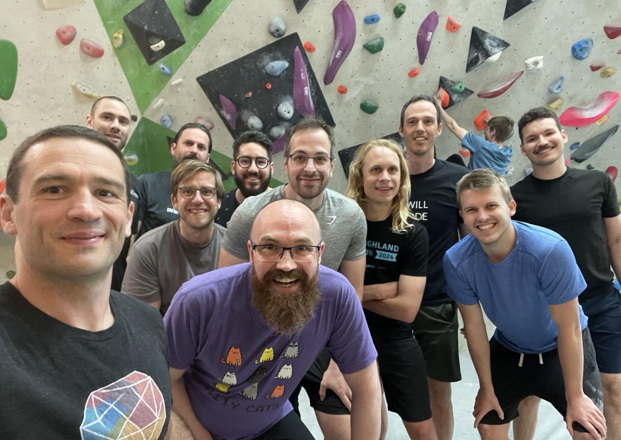 Group of attendees at the bouldering wall activity