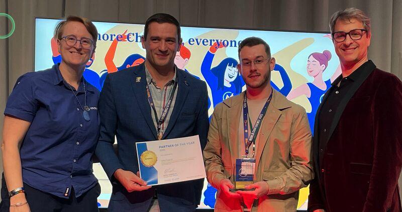 Frederik and colleague receiving the Mautic Partner of the Year award on stage