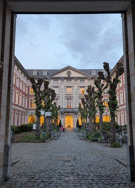 Leuven old market courtyard lit up at night